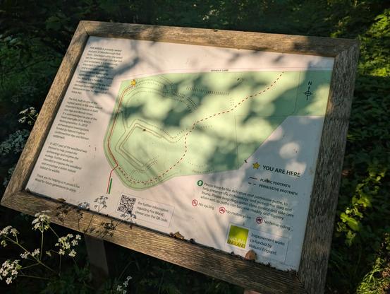 Signage describing the Iron Age fort, its age (old), and its importance (very); and the route through it you're allowed to take.