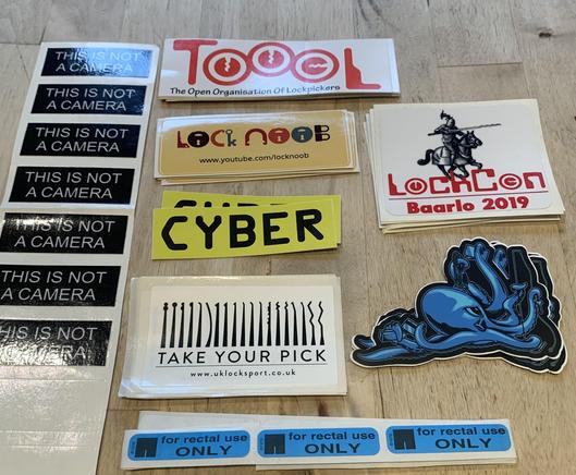 A collection of found stickers from LockCon 2019.