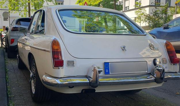 creme colored oldtimer car
rear view