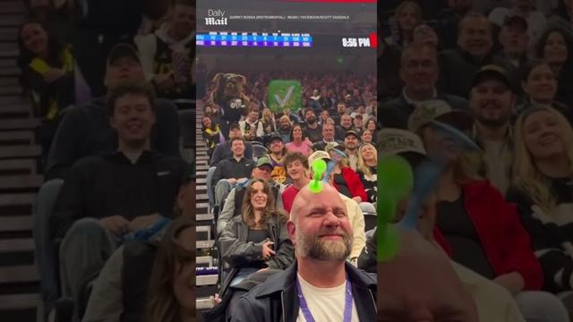 Utah Jazz mascot lands dart perfectly on guy's bald head