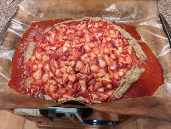 baked crostata - the crust collapsed and it's sitting in a pool of strawberry juice. fortunately the silpat contained all the yummy liquid!