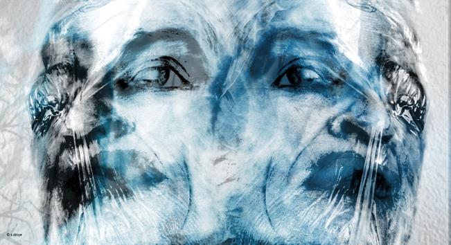 Color photograph in desaturated blue tones, landscape format, multiple exposure. Self-portrait (headshot) created by mirroring two photographs, a duplicate face, looking out from the left and right sides of the photograph. The face is blurred but with an intense gaze, additionally exposed with a blue motion-blurred photo. This creates a shadowy, unreal appearance. The overall impression is unpleasant, doubtful, expressing bad experiences and a strained mood.