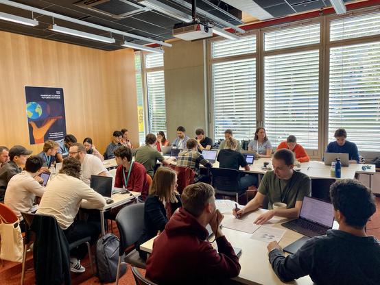 Group of participants working together at the hackathon.