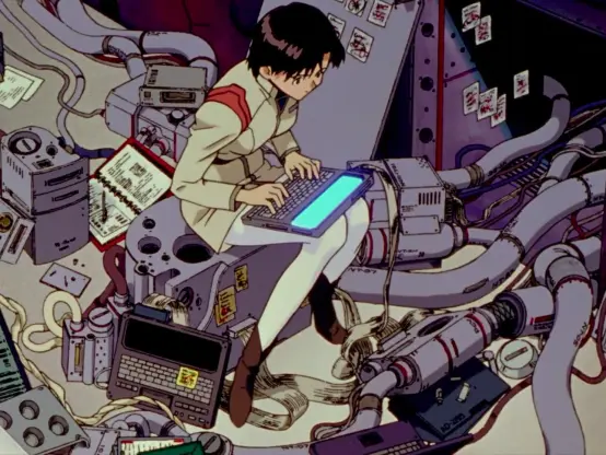 Still from an anime i dont know the name of, character sitting on a pile of parts typing on a flat computer, with parts and cables strewn all around