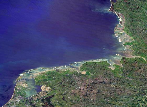 The Wadden Sea at the SE corner of the North Sea, with coast of Denmark, Germany and Netherlands. Mudflats and sand banks clearly visible in the tidal areas. Seen from NASA's Terra satellite 12. May 2025, almost cloudfree. 
Image enhancement with IrfanView.