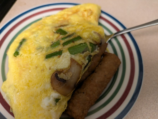 White mushrooms, asparagus, and goat cheese 3-egg omelette. Plus turkey sausage links.