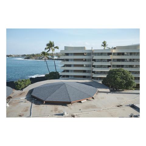 long view of hawaii coat in kona with a large resort in the foreground