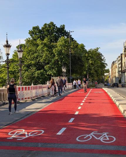 New bike lanes with red pathing. Wide enough for one bike in each direction.
