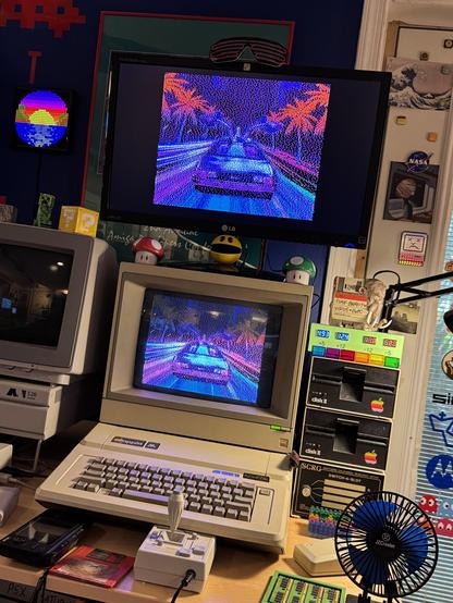 Apple IIe setup running a retrowave style slideshow on two displays