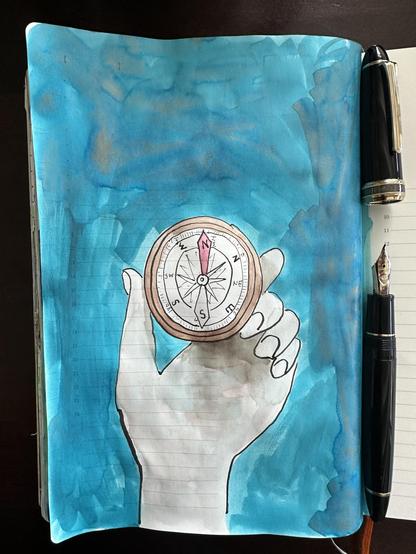 Sketch in sketchbook of a compass