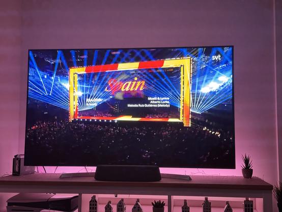 Picture of a TV showing the Eurovision Song Contest with the text “Spain” on screen in an italic serif font.