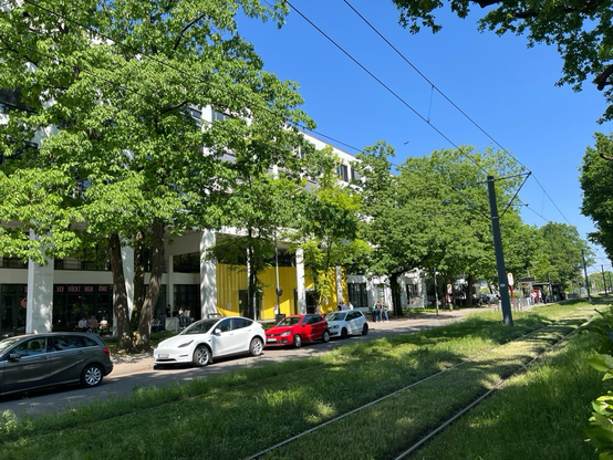 Entrance part of the DHBW building with blue sky and trees