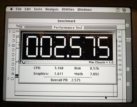 Photo of the performance test on a benchmark running on the Mac clone. It reports an average speed of 2.575 times a Mac Classic.