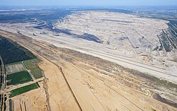 Source: Wikipedia, https://en.wikipedia.org/wiki/Hambach_surface_mine
Aerial view of a part of Germany's largest hole
Photo: https://upload.wikimedia.org/wikipedia/commons/thumb/e/e6/Aerial_image_of_the_Hambach_surface_mine_%28view_from_the_southeast%29.jpg/250px-Aerial_image_of_the_Hambach_surface_mine_%28view_from_the_southeast%29.jpg
