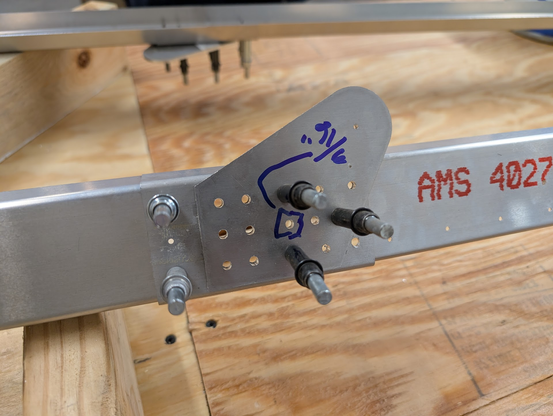 Rear spar where the two parts meet. It has a reinforcement bracket to splice it together and then a thick doubler plate to make it stronger. All the holes were drilled to #20 and one hole is marked to be upsized again to 3/16"