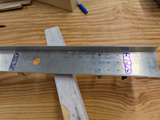 Doubler plate laying inside a spar part for the root of the wing. Two rows of holes have been marked off as a reminder to NOT drill them.