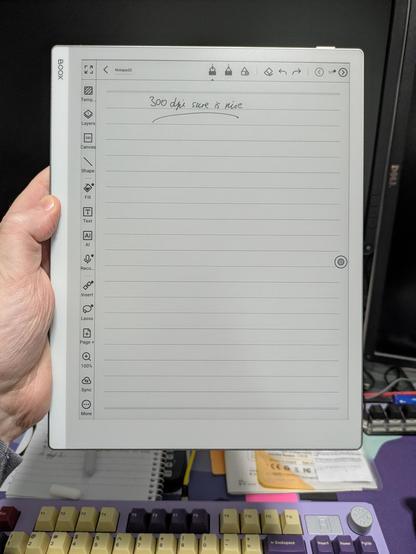 Photo of me holding Onyx Boox Go 10.3. On-screen is a note with handwritten text: 300dpi sure is nice.