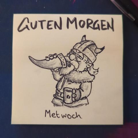 Auf einer gelben Haftnotiz steht "guten Morgen" darunter ist ein Wikinger zu sehen der gerade einen Schluck aus einem Trinkhorn nimmt.
Es ist MetWoch