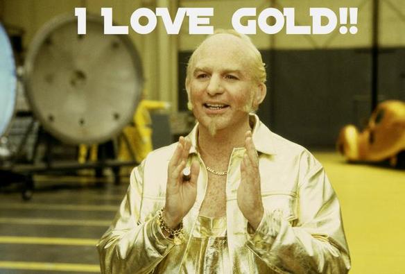 Goldmember from the Austin Powers movies, a balding man with an entirely-golden wardrobe, holding his hands together in front of him with the caption "I love gold!" written across the top.