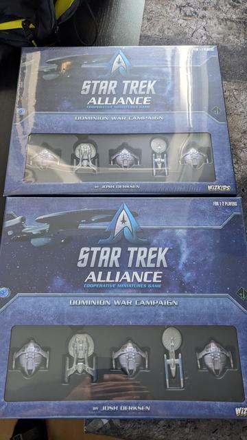 Two blue boxes star trek alliance with little space ships seen on the lower parts.
