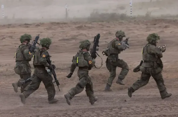 German soldiers take part in a drill during the NATO Quadriga military exercise, in Pabrade, Lithuania, in May 2024