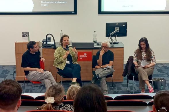 Photo of Rui Lopes, Natalia Telepneva, Sanjay Seth, and another woman sitting on chairs in front of the audience, during the book presentation at the University of Strathclyde.