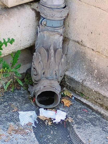 a downspout outside the Louvre museum