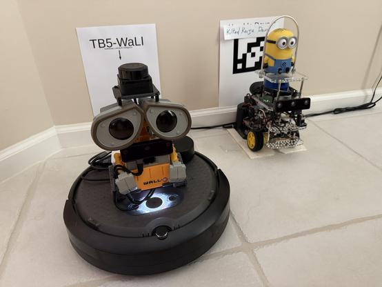 Turtlebot 5 WaLI (Raspberry Pi 5 running Turtlebot 4 stack on an iRobot Create educational robot platform next to a GoPiGo3 robot running the beta ROS 2 Kilted Kaiju on a Raspberry Pi 4 named Kilted Dave.