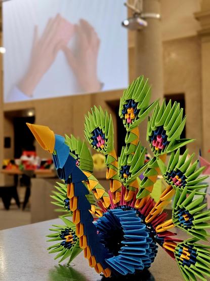 Origami peacock in an exhibition hall