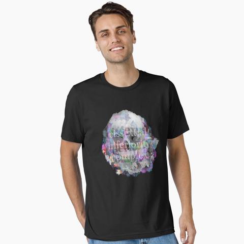 a black tshirt with a design: the design features a skull and glitchy trans pride colors in neon. overlayed text reads "cissexual inferiority complex"