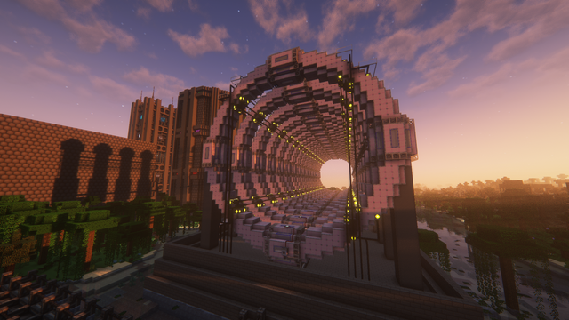 Minecraft screenshot with shaders:

A bunch of pink circular multiblocks stacked horizontally

A bunch of towets are visible in the background and the shadow of  the circle is projected on a large  gray box