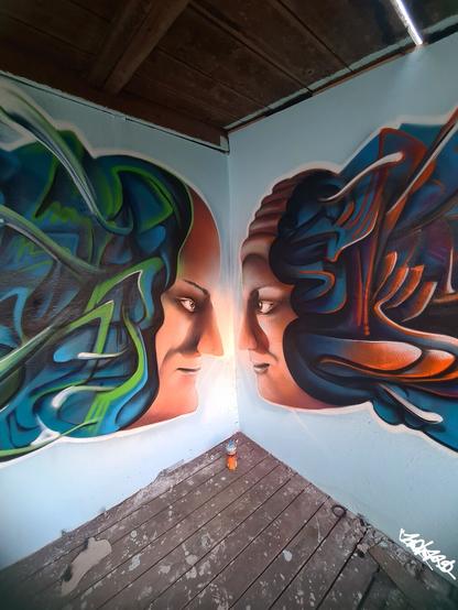 graffiti mural of two faces facing each other by graffiti artist Fabian Zolar, graffiti streetart artist artwork portraits