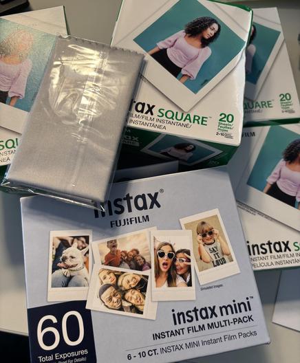 Boxes and boxes of Fuji instant film. Square and mini. A free lens wipe was included.
