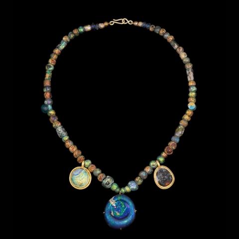 Roman glass bead necklace, dated circa 2nd/3rd Century CE

Comprising numerous highly iridescent beads of globular and other forms, the necklace is 36.8cm long.  Three circular pendants are suspended from the necklace, two with stamped motifs, one of them showing the Star of David

Sold at auction by Sothebys 

#BeadSocietyGB #Beads #HistoryOfBeads #RomanGlassBeads #Sothebys