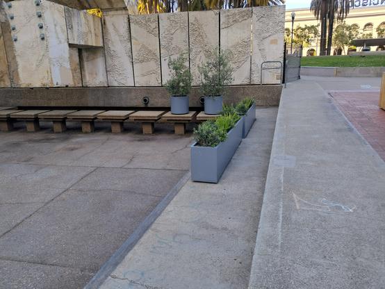 the vaillancourt fountain, but the pool is drained and the start of the stepping stone path is blocked by large planters