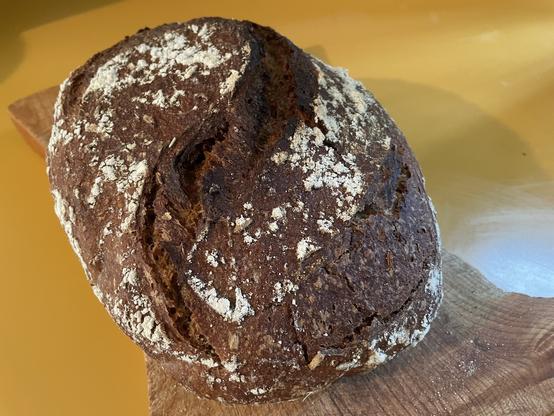 A fresh loaf of sourdough rye bread.
