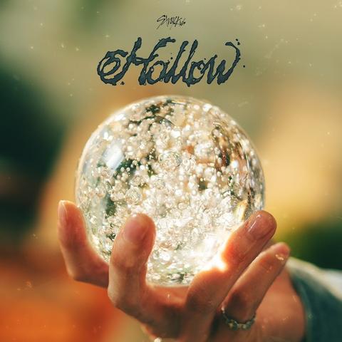 Teaser image for Stray Kids *Hollow** album, which is a photo of I.N's hand holding a wet(?) glass ball full of bubbles