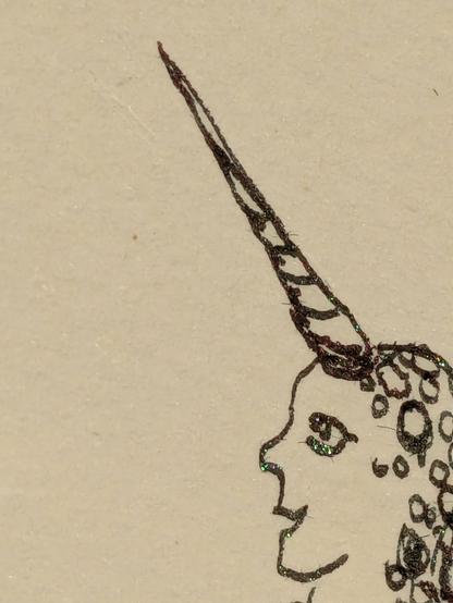 Close up of narwhal mer, the sparkly ink make them look like they have glittery mascara :-)