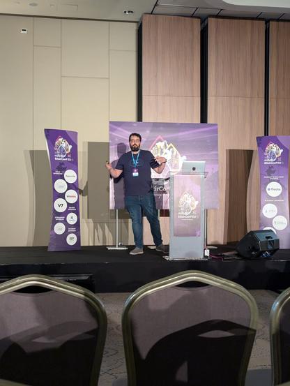 @rbino speaking at ElixirConfEU, presenting his own tigerbeetlex library
