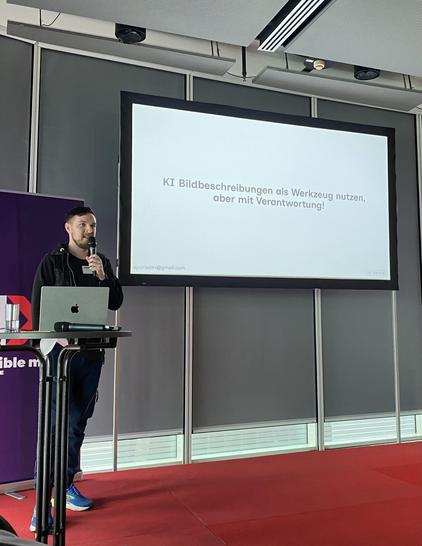 Denis on stage of the A-Tag