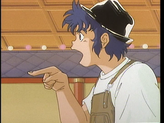 We're looking at a profile of Kento. He's in casual clothes, wearing a black hat, brown overalls, and a white tee. He appears to be pointing and saying something.