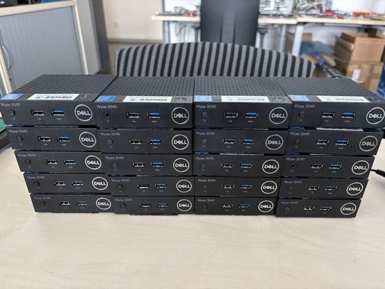 A stack of 20 tiny Dell 3040 thin clients.