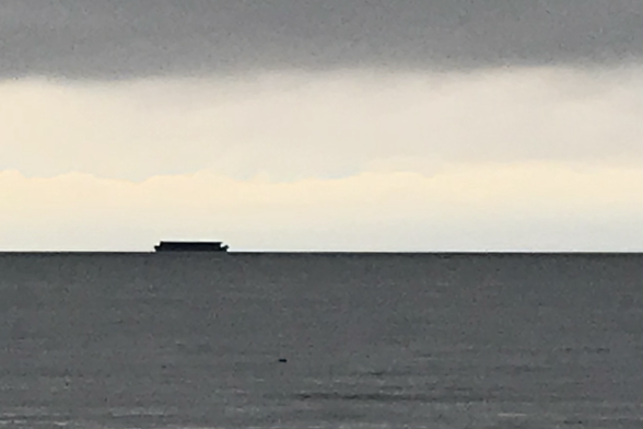Bleak seascape with what appears to be ’The Ark’ on the horizon.