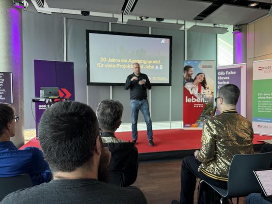 Jo giving his closing remarks on stage.