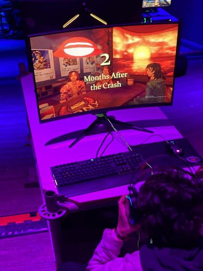a photo of a screen on which the video game mouthwashing runs. a title card on screen reads two months after the crash
