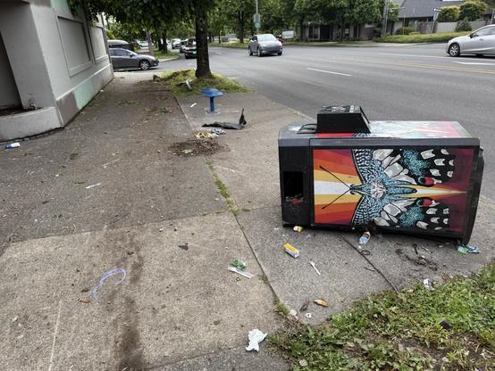 Crash scene on the sidewalk.