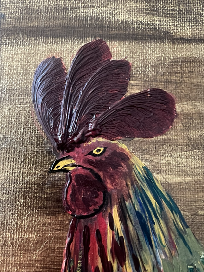 Close up of a pained cockerel head on an acrylic gold canvas