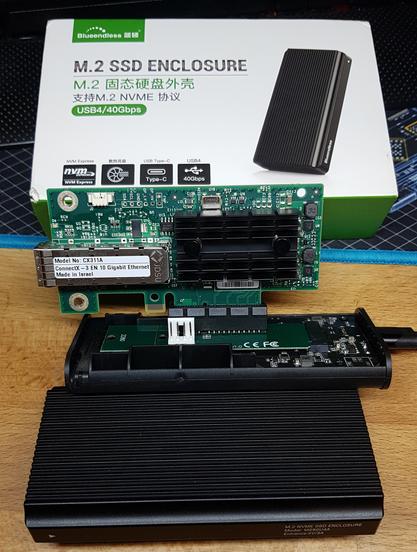 People seem to be building DIY Thunderbolt/USB4 eGPUs with similar ASMedia ASM2464(PD?) boards

I'll use the 5V USB supply, which is present at the regulator in the bottom right, by the 4 large unpopulated pads - it's an AMS1117, its left pin is GND, the right pin is 5V Vin - that's where i'll tap-off.

…i hope to save at least 60 bucks on a 10gig SFP+ NIC (10GBase-T is not an option, because an active transceiver might overheat the cheap Chinese [Realtek-based] switch, it MUST be DAC)