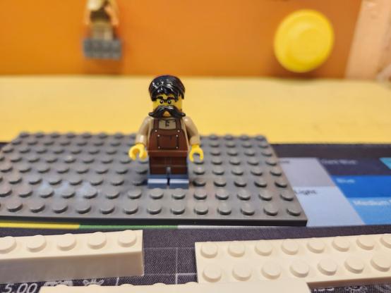 A Lego minifig with a mustache