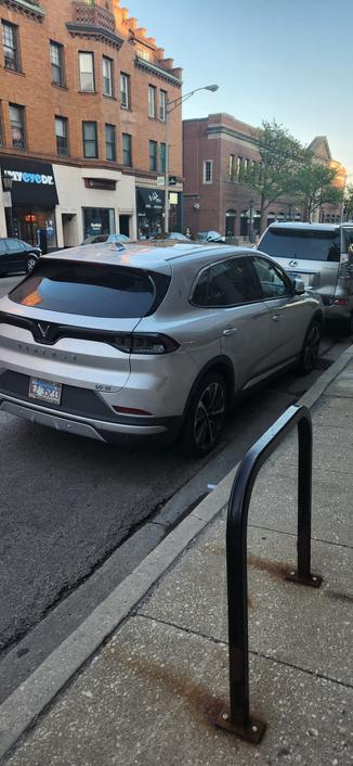 A street parked Vinfast VF8, silver